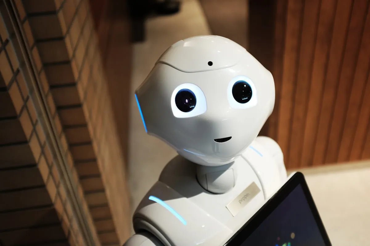 Robot hand representing AI writing assistance technology