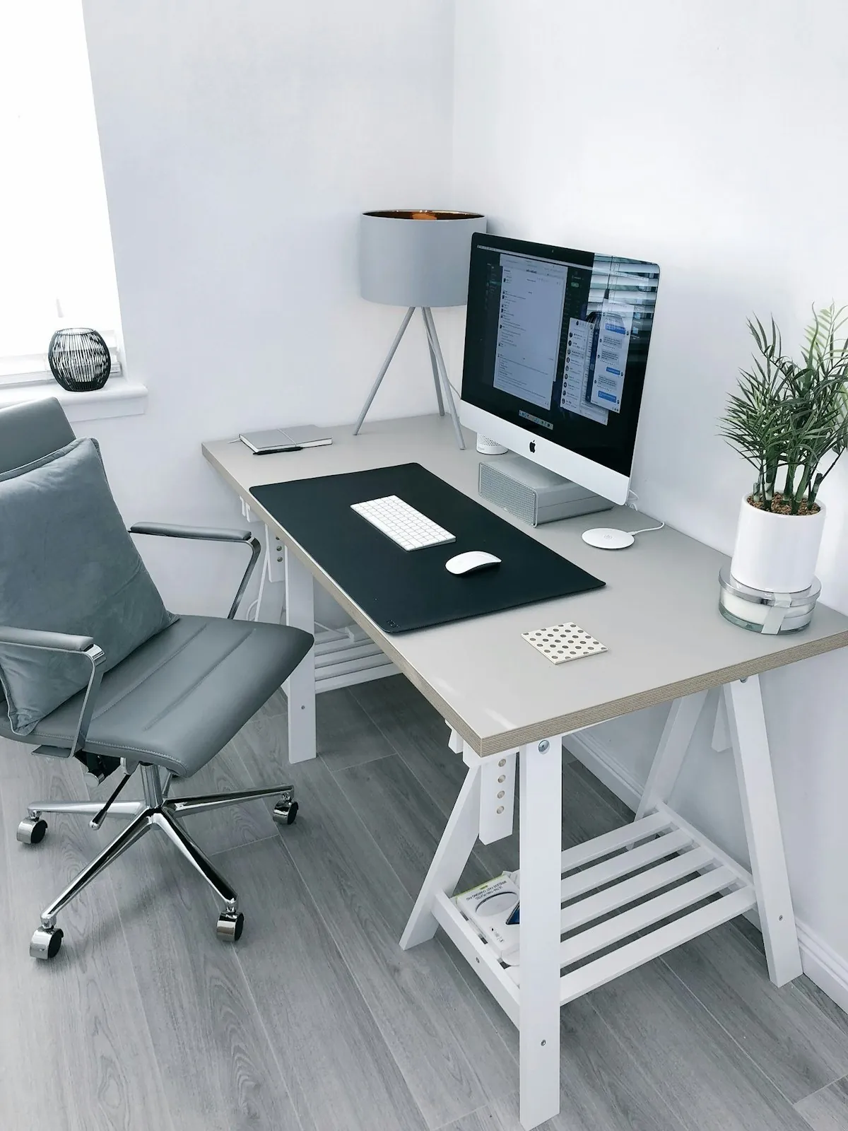 Standing desk converter on an office desk with dual monitors