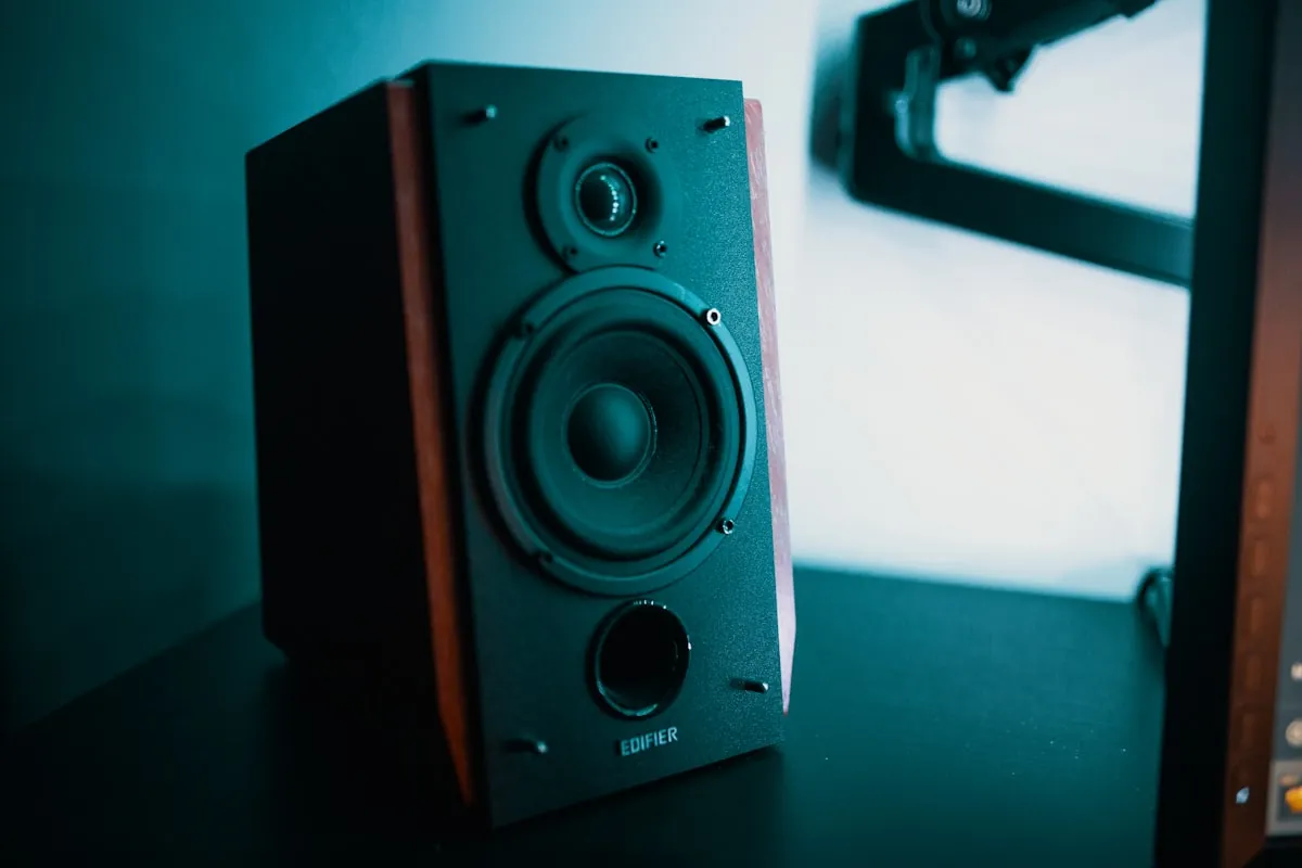 Desktop speakers on a home office desk setup