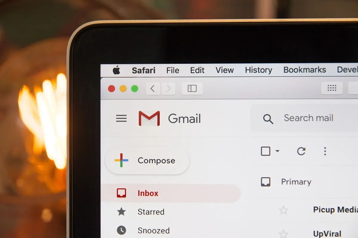 Professional email communication on laptop and smartphone