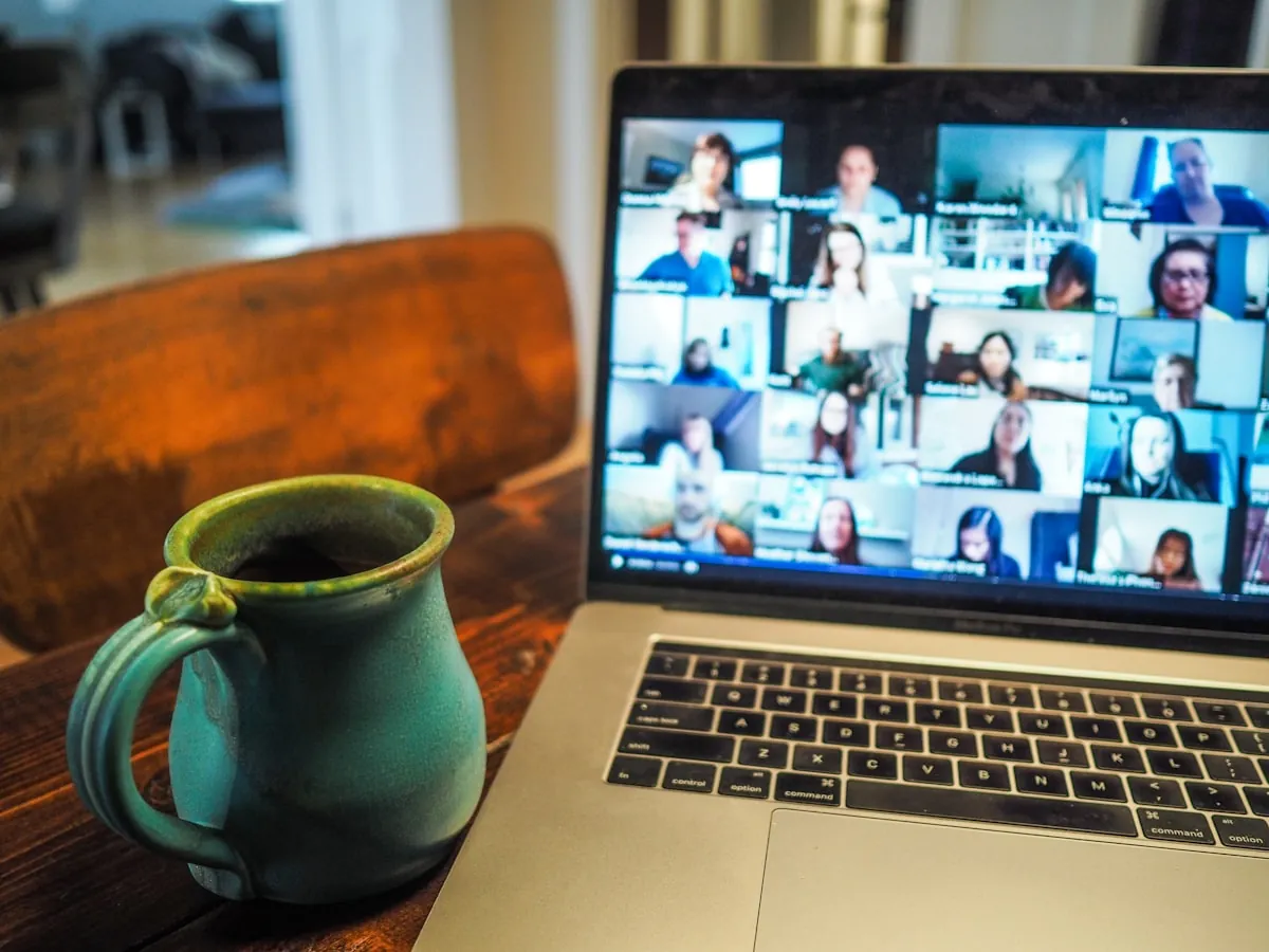 Remote team video conference call on laptop screen