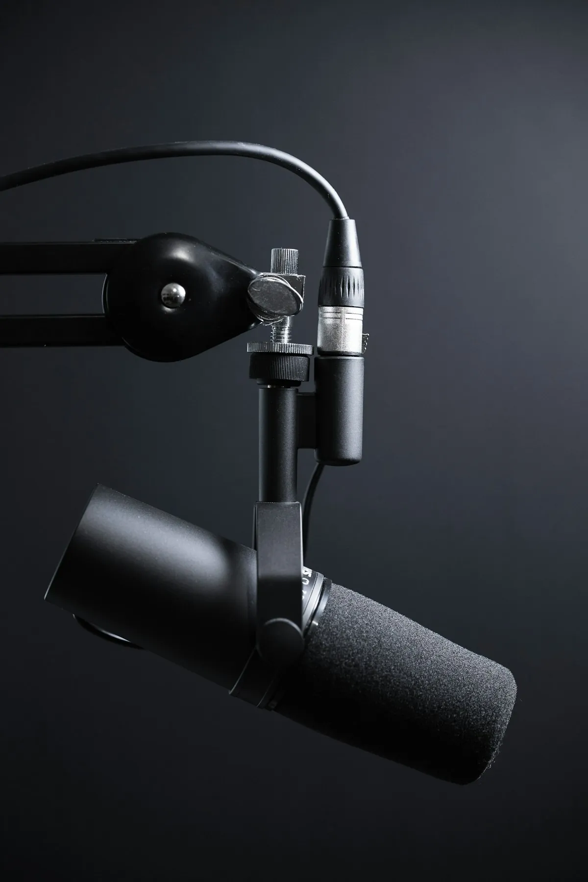 Professional USB microphone on desk for remote work