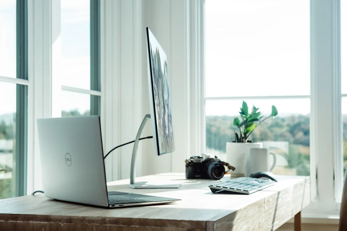 Modern home office setup with standing desk and dual monitors