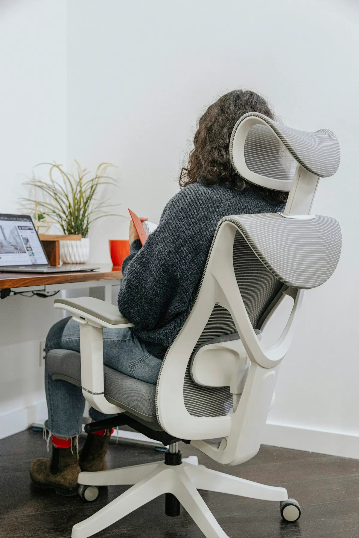 Woman at ergonomic workspace with proper posture